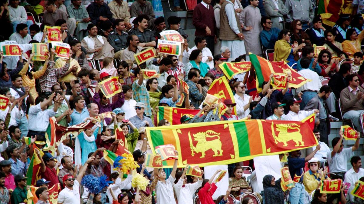 Sri Lankan supporters celebrate their team's first ever World Cup triumph on March 17, 1996, at the Gaddafi Stadium in Lahore. (AFP file)