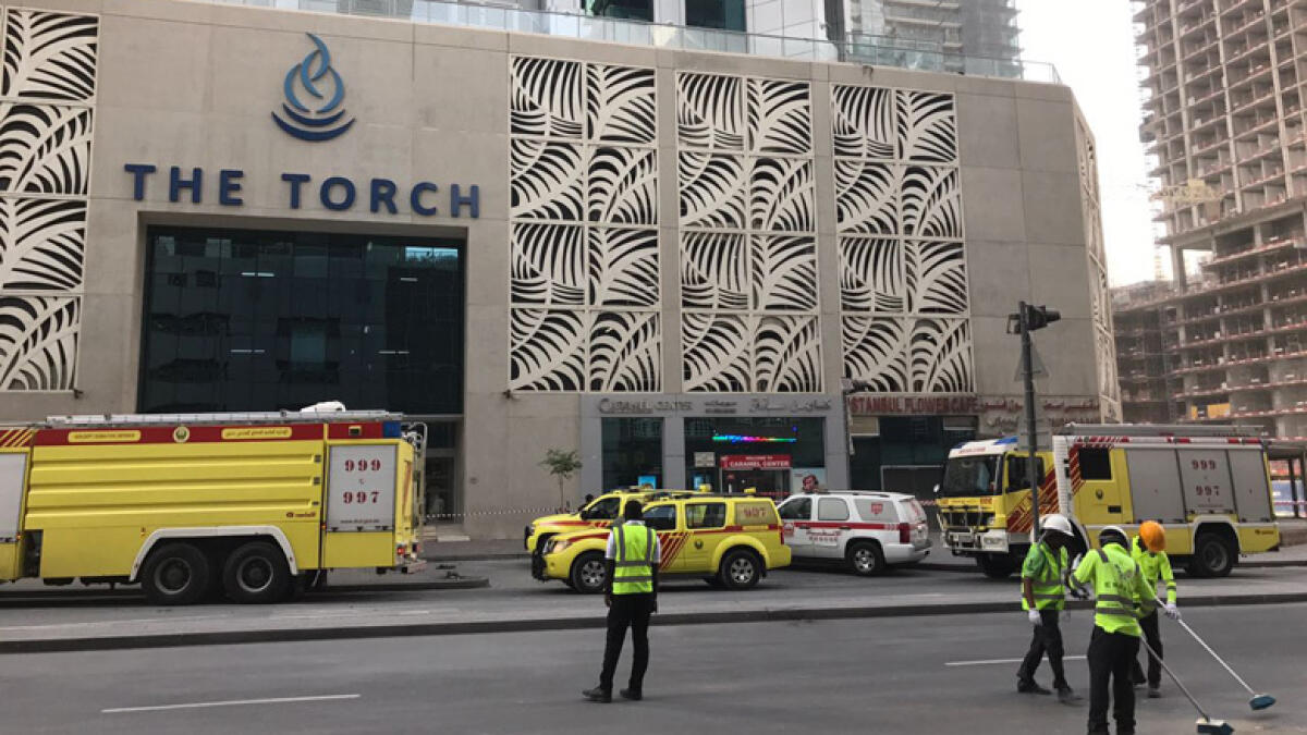 Photos: Fire put out, cleanup work outside Torch Tower in Dubai Marina
