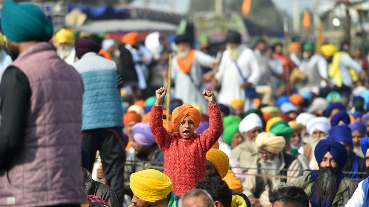 A child of a farmer shouts slogans during the protest against new agriculture laws, in New Delhi, India. — Photo: PTI