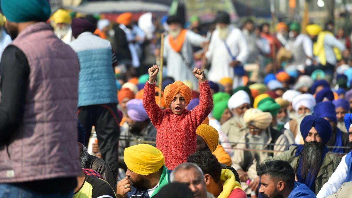 A child of a farmer shouts slogans during the protest against new agriculture laws, in New Delhi, India. — Photo: PTI