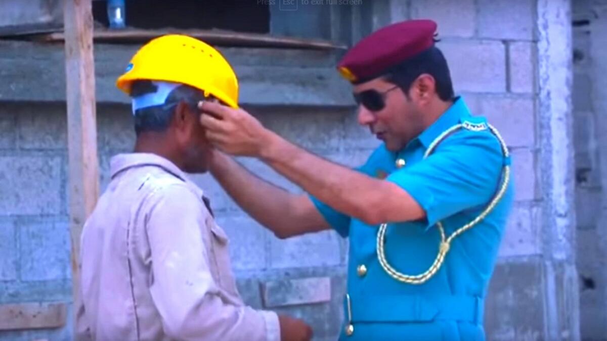 Video: RAK Police give workers shades, helmets