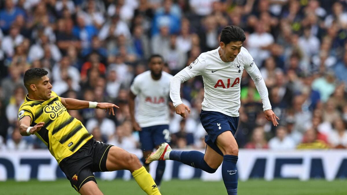 Tottenham Hotspur's Son Heung-Min (right) runs away from Watford's Adam Masina (left) during the English Premier League match. — AFP