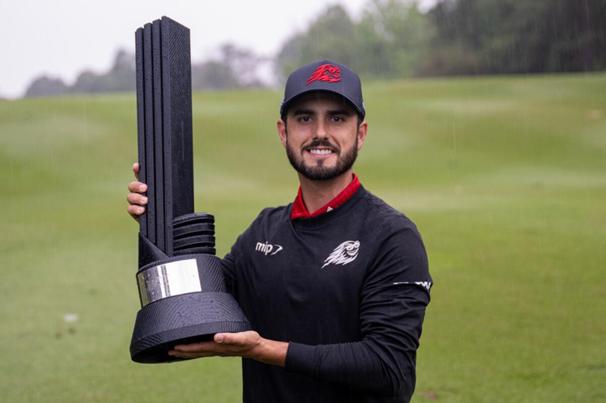 Abraham Ancer proudly show-off the LIV Golf Hong Kong Trophy. - Agencies