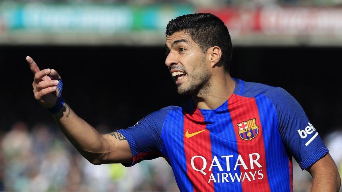 Suarezs late-goal helps Barca draw against Betis