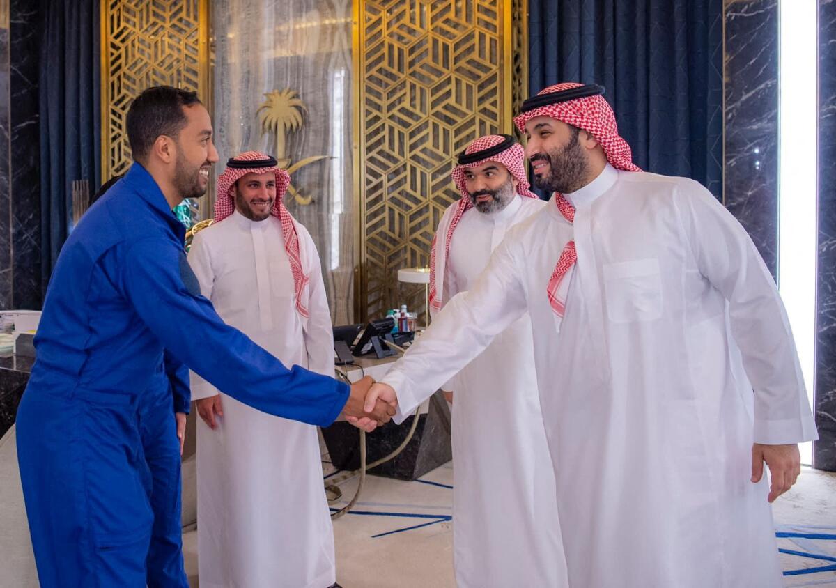 Crown Prince Mohammed bin Salman receives Saudi astronaut Ali Al-Qarni.