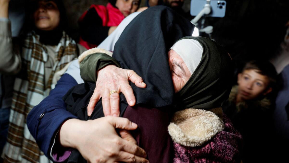 Family members hug released Palestinian prisoner Fatima Amarneh amid a hostages-prisoners swap deal between Hamas and Israel.— Reuters