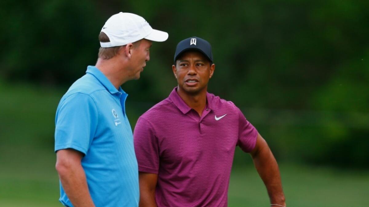 Tiger Woods and Peyton Manning chat during the 2018 Memorial Tournament pro-am. - AFP file