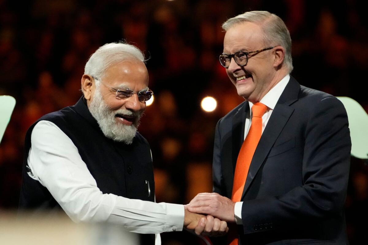 Indian Prime Minister Narendra Modi, left, greets Australian Prime Minister Anthony Albanese during an Indian community event at Qudos Bank Arena in Sydney, Australia, on Tuesday. Photo: AP