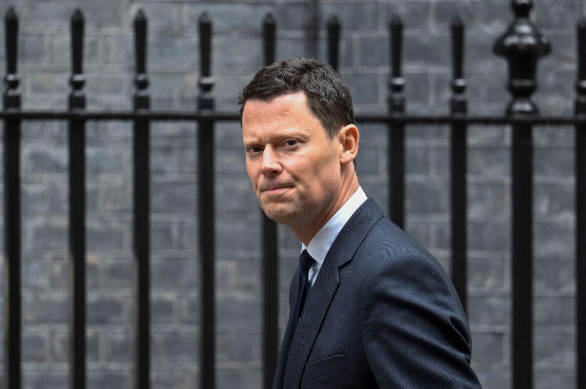 British Conservative member of parliament Alex Chalk walks outside Downing Street, in London, Britain, on Friday. — Reuters