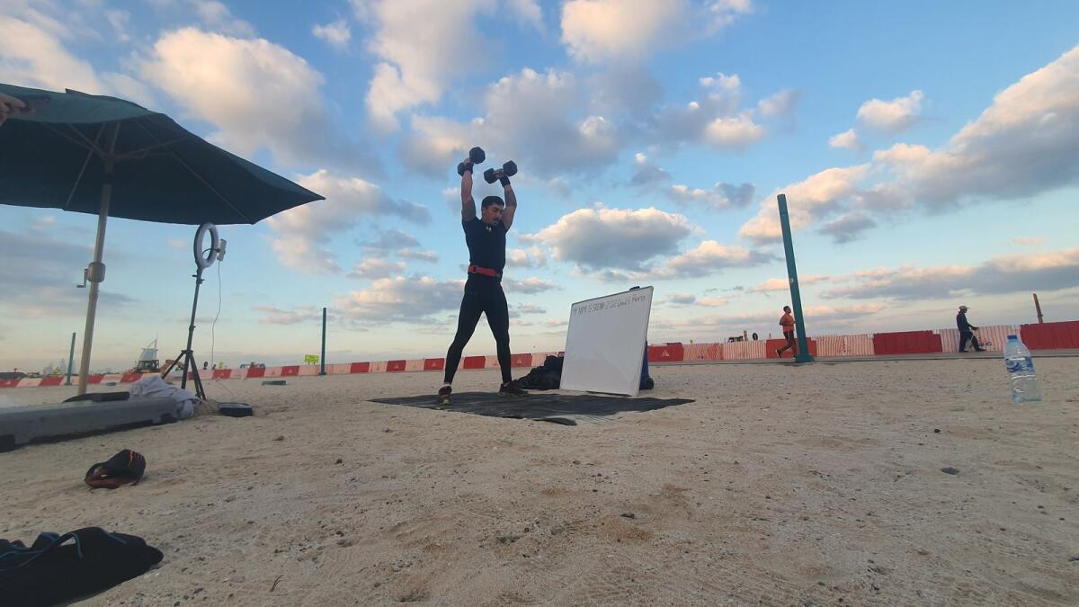 Seena Akbary completed 2,022 devil presses with dumbbells weighing 20kg in 9 hours 32 minutes at Kite Beach in Dubai. Photo: SM Ayaz Zakir