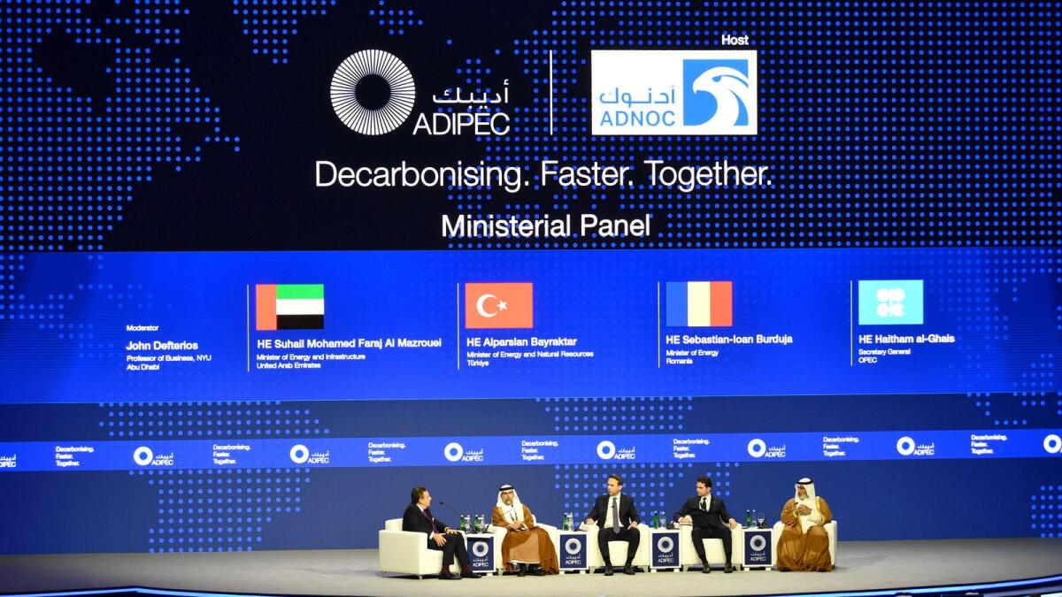 Suhail bin Mohamed Al Mazrouei and other panellists at a session in ADIPEC. — Wam