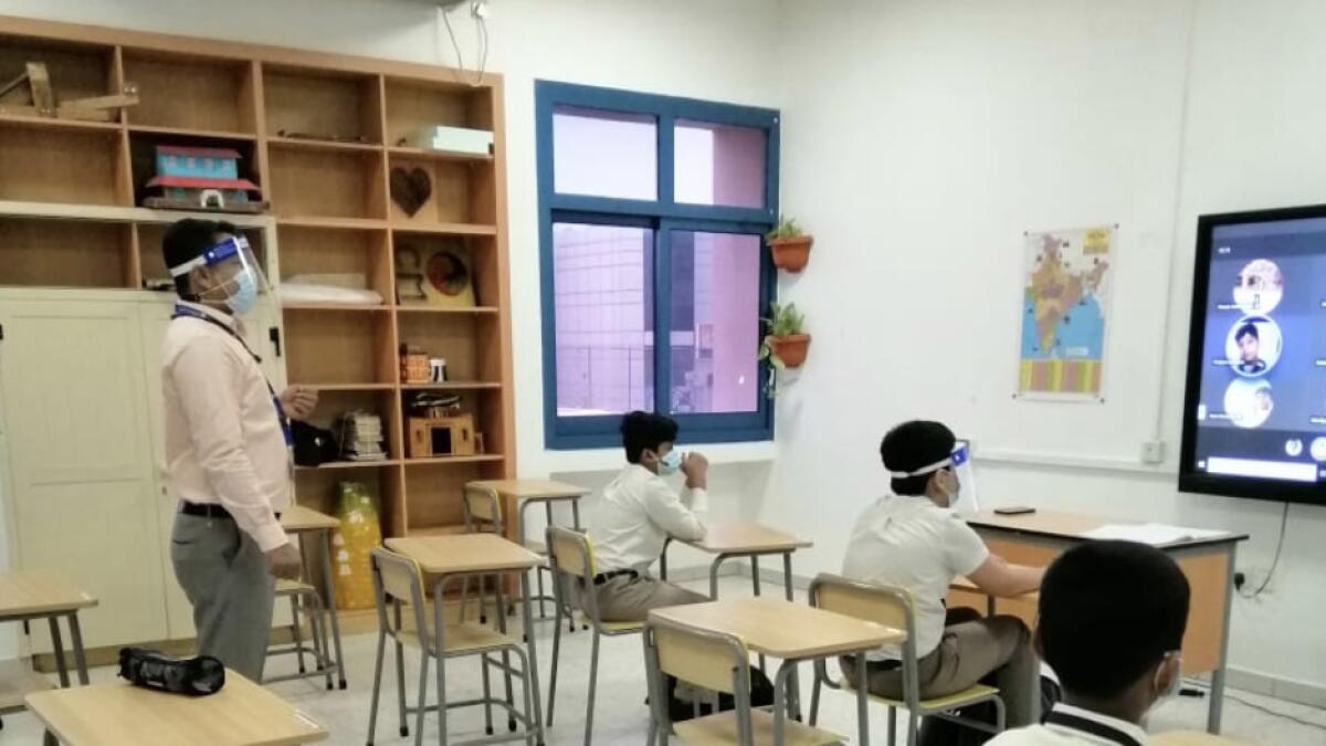 Empty seats, teachers, wearing, headset, mics, Inside, Dubai classroom, first day of school