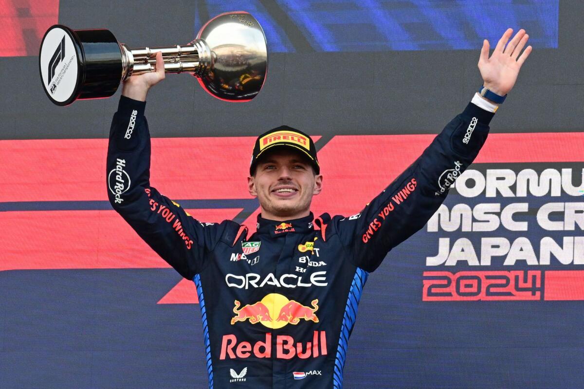 Red Bull Racing's Dutch driver Max Verstappen celebrates on the podium after the end of the Formula One Japanese Grand Prix. — AFP
