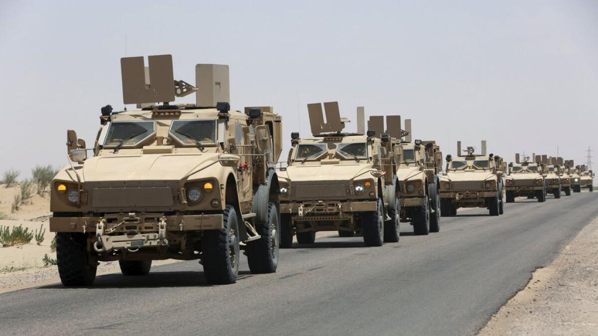 Military vehicles carrying Gulf Arab soldiers arrive at Yemens northern province of Marib on September 8, 2015.