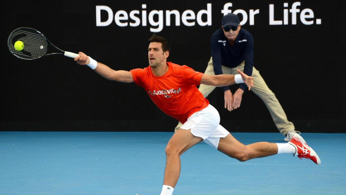 Novak Djokovic of Serbia hits a return against Jannik Sinner of Italy during the 'A Day at the Drive' exhibition tournament in Adelaide on Friday. (AFP)