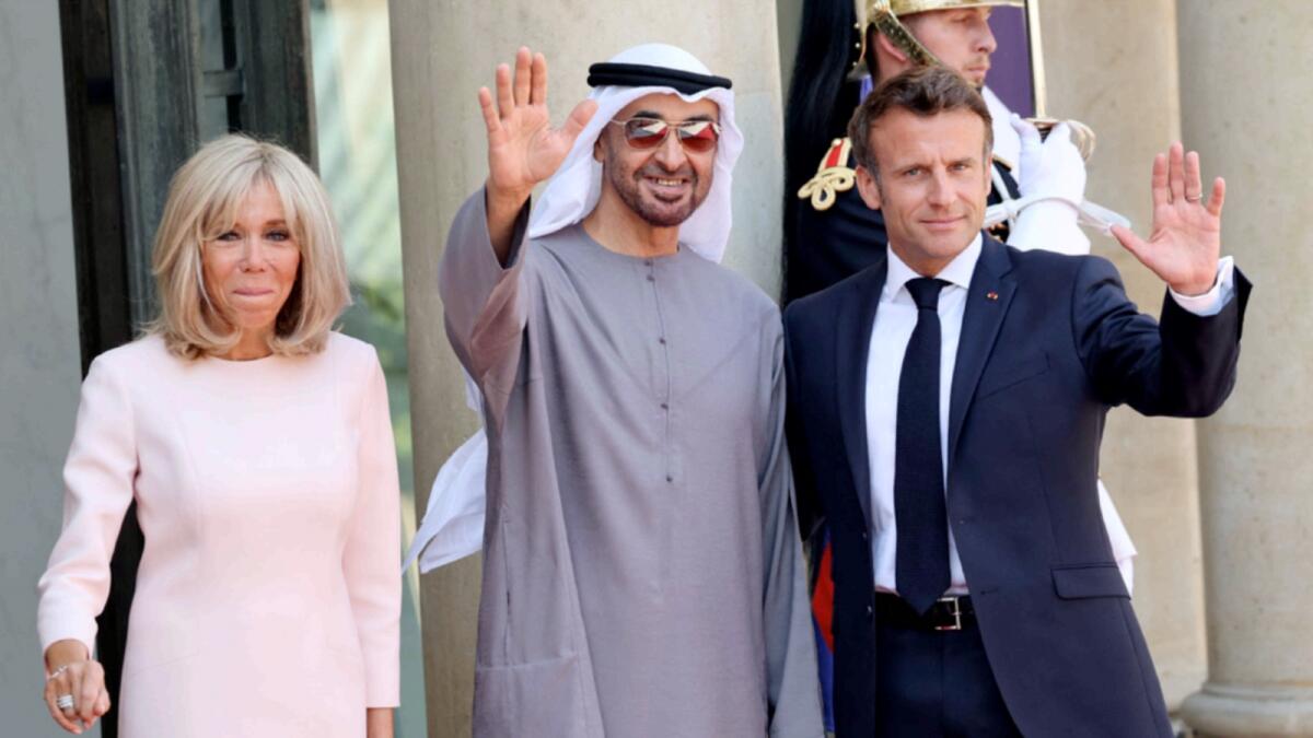 The President, His Highness Sheikh Mohamed bin Zayed Al Nahyan, with French President Emmanuel Macron and his wife Brigitte Macron at a working lunch at the Elysee presidential Palace in Paris. — AFP