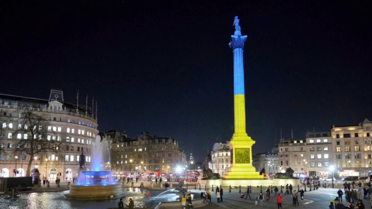 Nelson's Column in Trafalgar Square, London, is lit up with the colours of the Ukraine flag. — AP