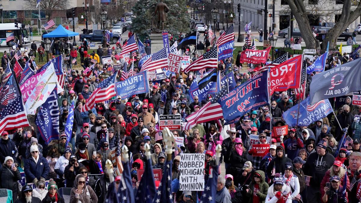 President Trump supporters rally at the Capitol building in Lansing, Mich., Saturday, Nov. 14, 2020. AP