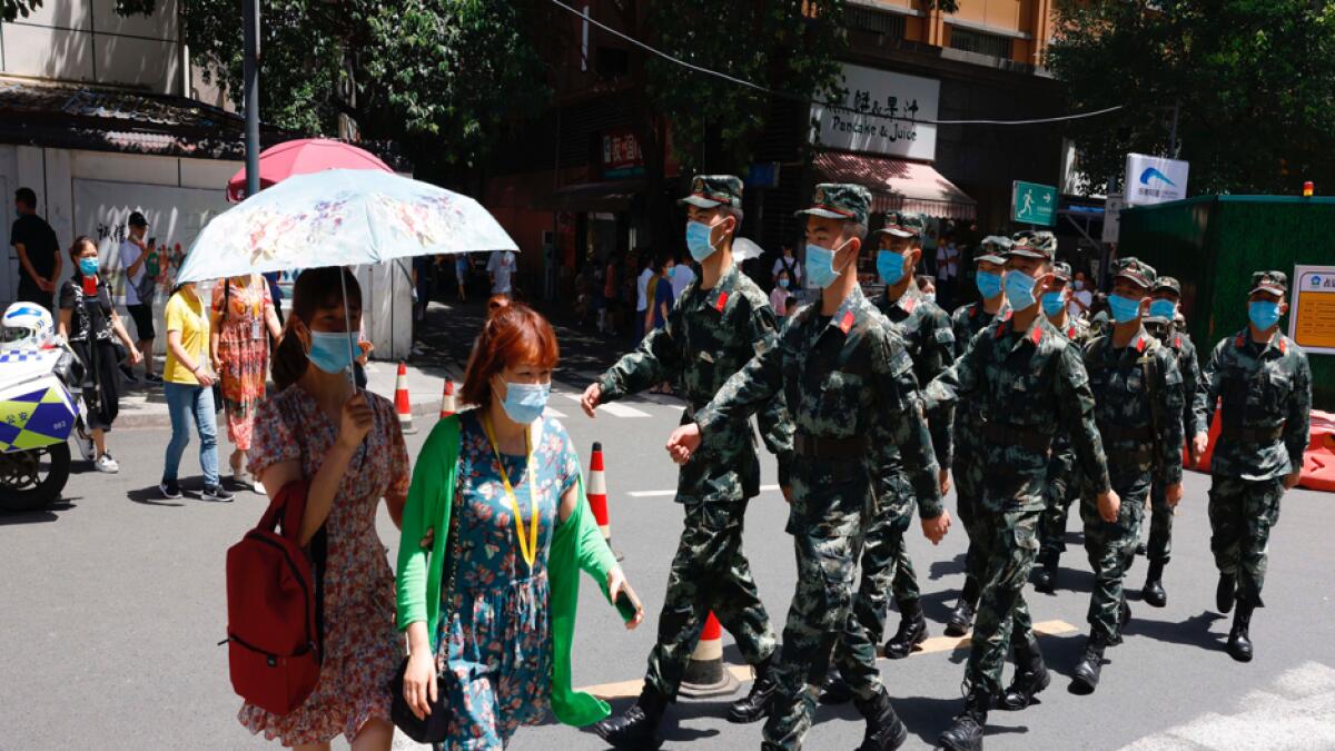 Chinese paramilitary policemen march near the US Consulate in Chengdu in southwest China's Sichuan province on Sunday, July 26, 2020. China ordered the US on Friday to close its consulate in the western city of Chengdu, ratcheting up a diplomatic conflict at a time when relations have sunk to their lowest level in decades. Photo: AP
