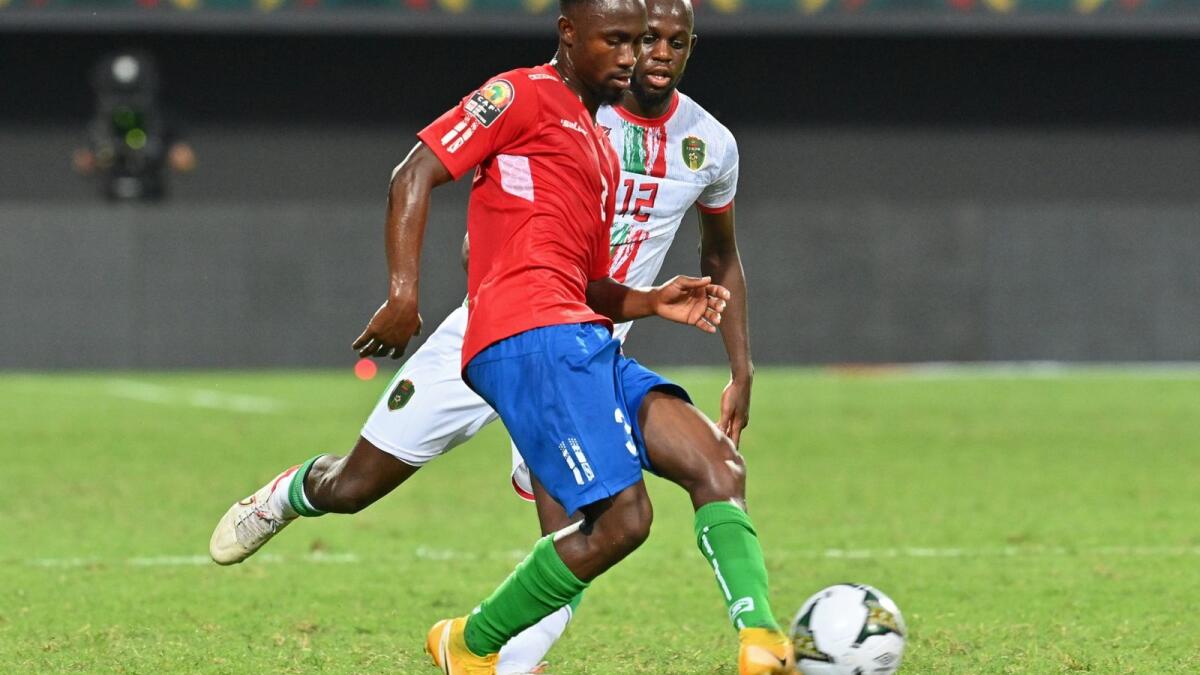 Gambia midfielder Ablie Jallow (front) is challenged by Mauritania's Almike Moussa N'Diaye during the match on Wednesday. — AFP