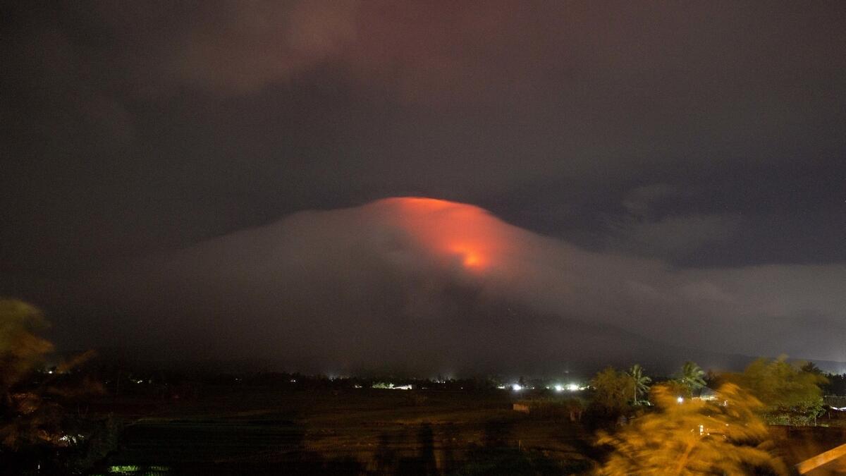Lava cascades down the slopes of Mayon volcano as seen from Legazpi city, Albay province, around 340 kilometers (210 miles) southeast of Manila, Philippines. AP