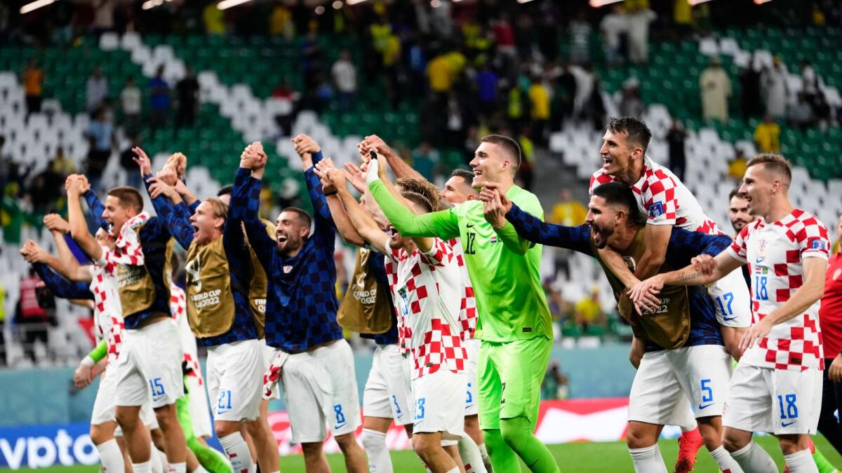 Croatia players celebrate defeating Brazil in a World Cup quarter-final match. — AP