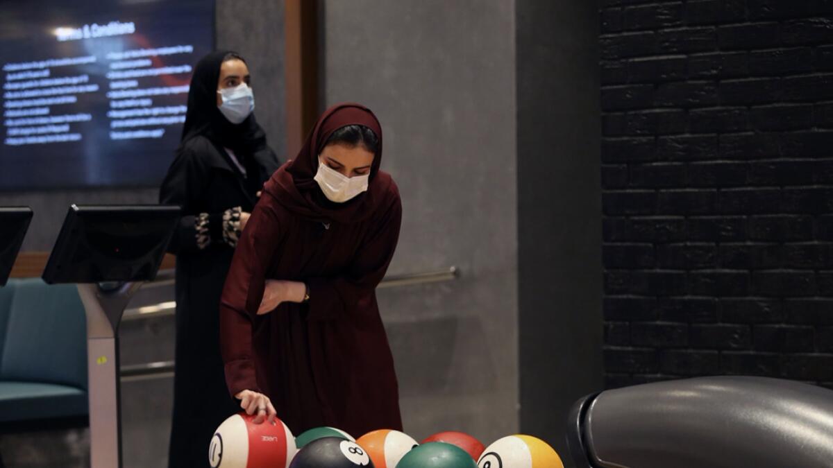 A Saudi woman wearing a protective mask bowls in Riyadh Park Mall, after the government lifted the coronavirus lockdown restrictions in Riyadh, Saudi Arabia. Photo: Reuters(Research: Mohammad Thanweeruddin/Khaleej Times)