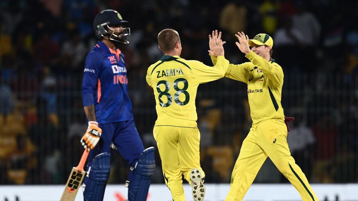 Australia's Adam Zampa (centre) celebrates with captain Steve Smith (right) after the dismissal of India's Ravindra Jadeja (left) during the third one-day international. — AFP