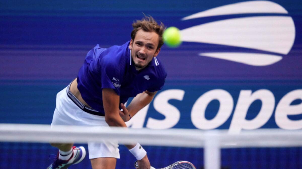 Russia's Daniil Medvedev hits a return to Canada's Felix Auger-Aliassime during their 2021 US Open Tennis tournament men's semifinal. — AFP