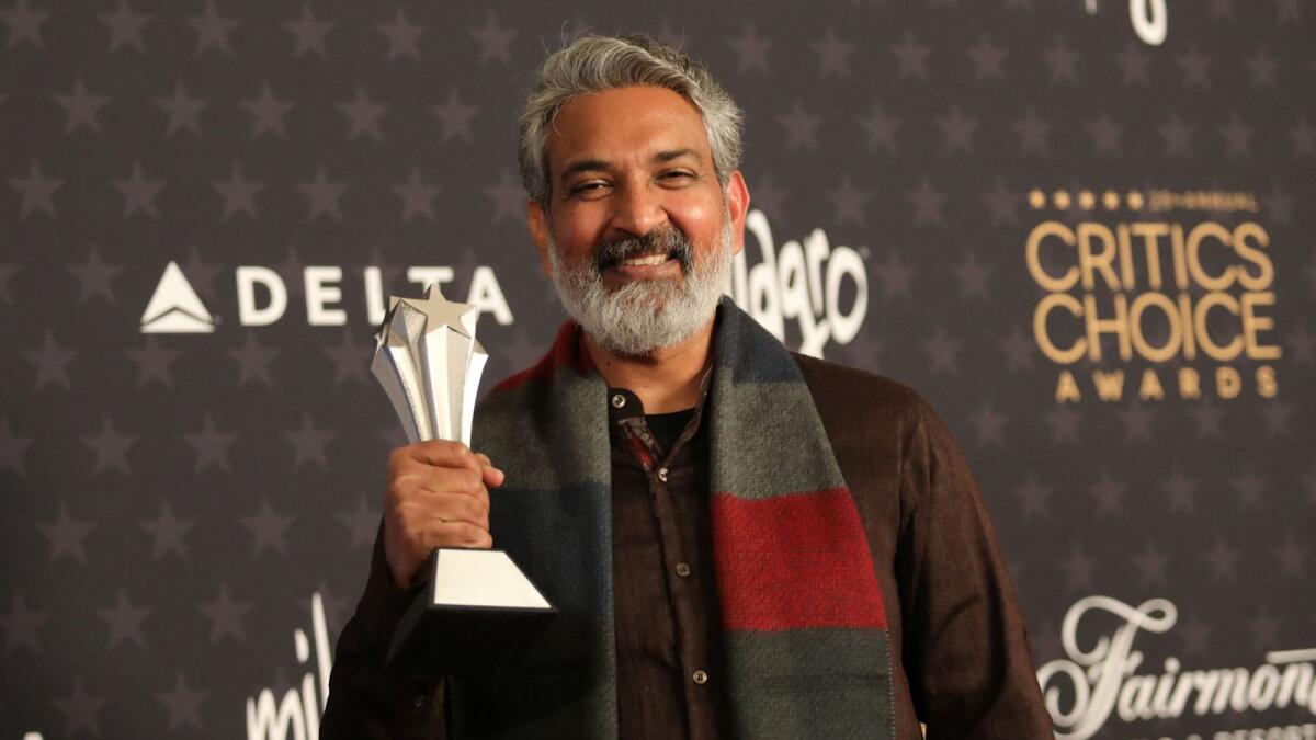 SS Rajamouli, poses with the Best Foreign Language Film for 'RRR'