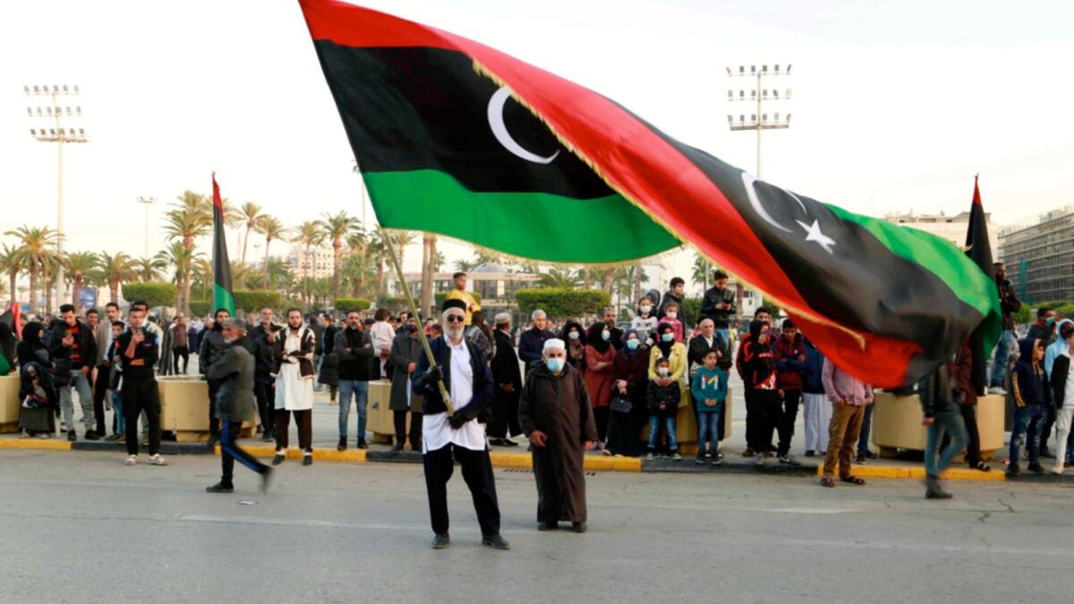 Libyans celebrate the 70th anniversary of their country's independence in Martyrs' Square, Tripoli, on December 24, despite widespread disappointment over the postponement of the presidential elections, which were scheduled to take place on the same day. — AP