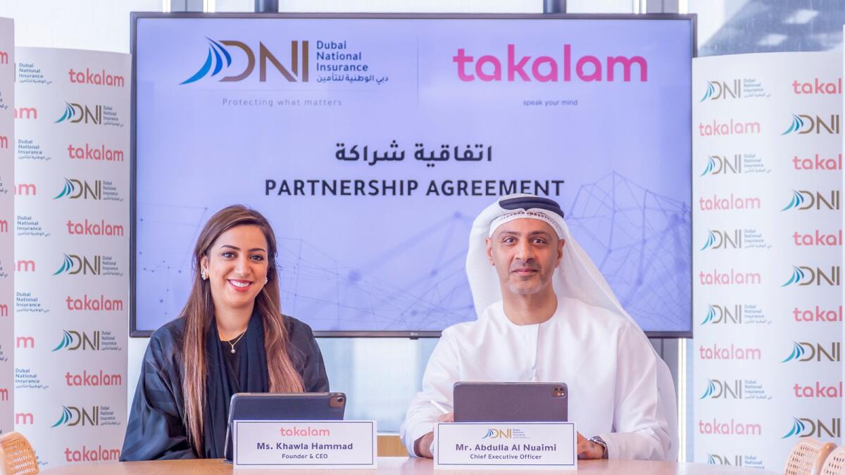 Ms Khawla Hammad, Takalam’s CEO, and Abdulla Al Nuaimi, chief executive officer of Dubai National Insurance (DNI), after signing the agreement. — Supplied photo