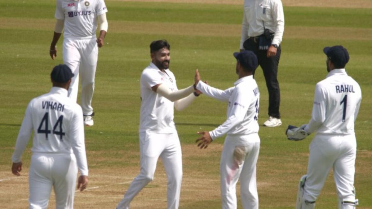 Mohammed Siraj celebrates a wicket with teammates. (BCCI Twitter)