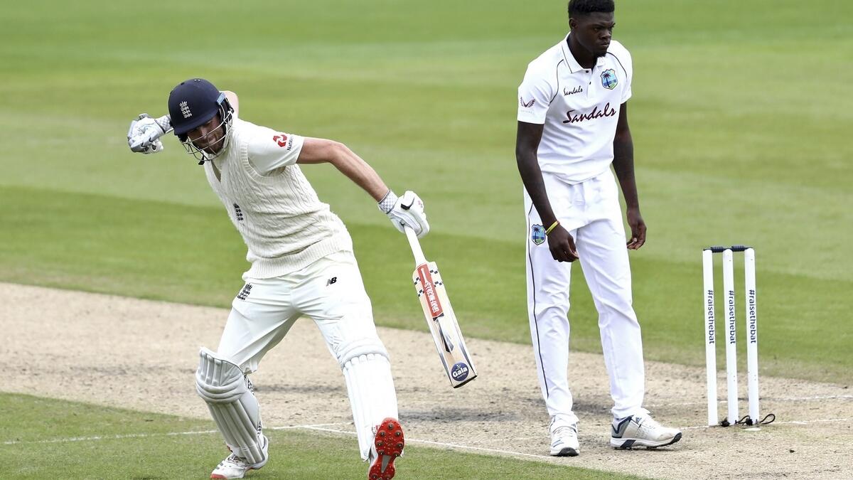 England's Dom Sibley celebrates scoring a century during the second day of the second  Test match against  West Indies at Old Trafford