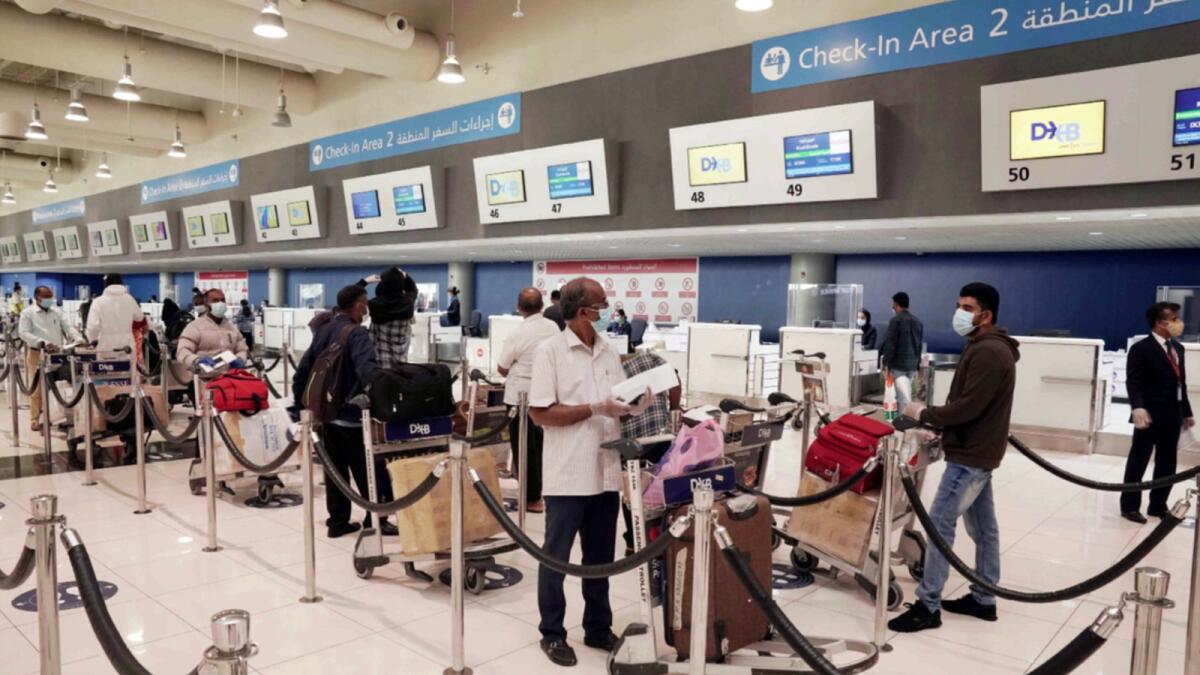 Passengers to India at Dubai airport. — Reuters file