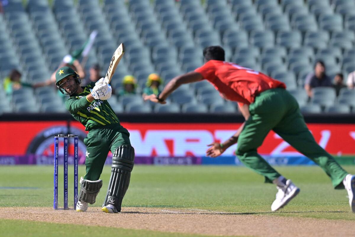 Pakistan's Mohammad Haris (left) plays a shot. — AFP