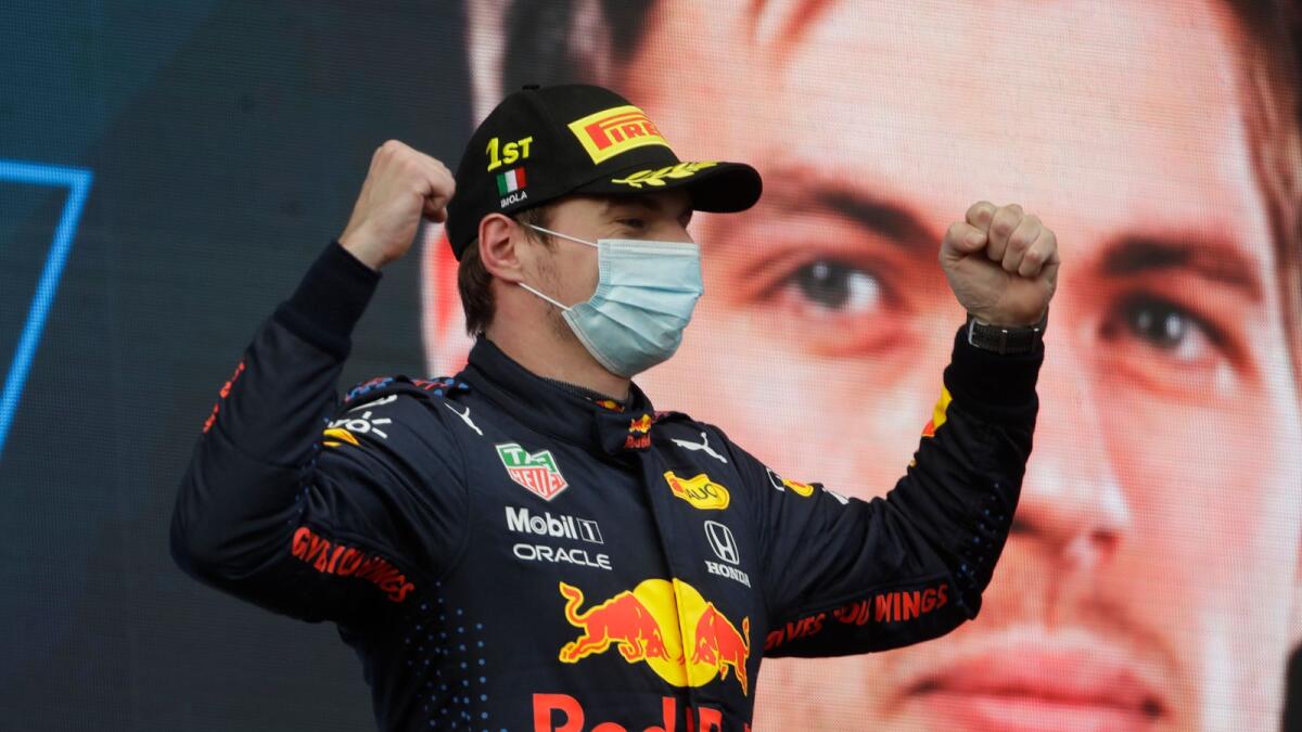 Red Bull driver Max Verstappen of the Netherlands celebrates on podium after winning the Emilia Romagna Formula One Grand Prix, at the Imola racetrack. — AP