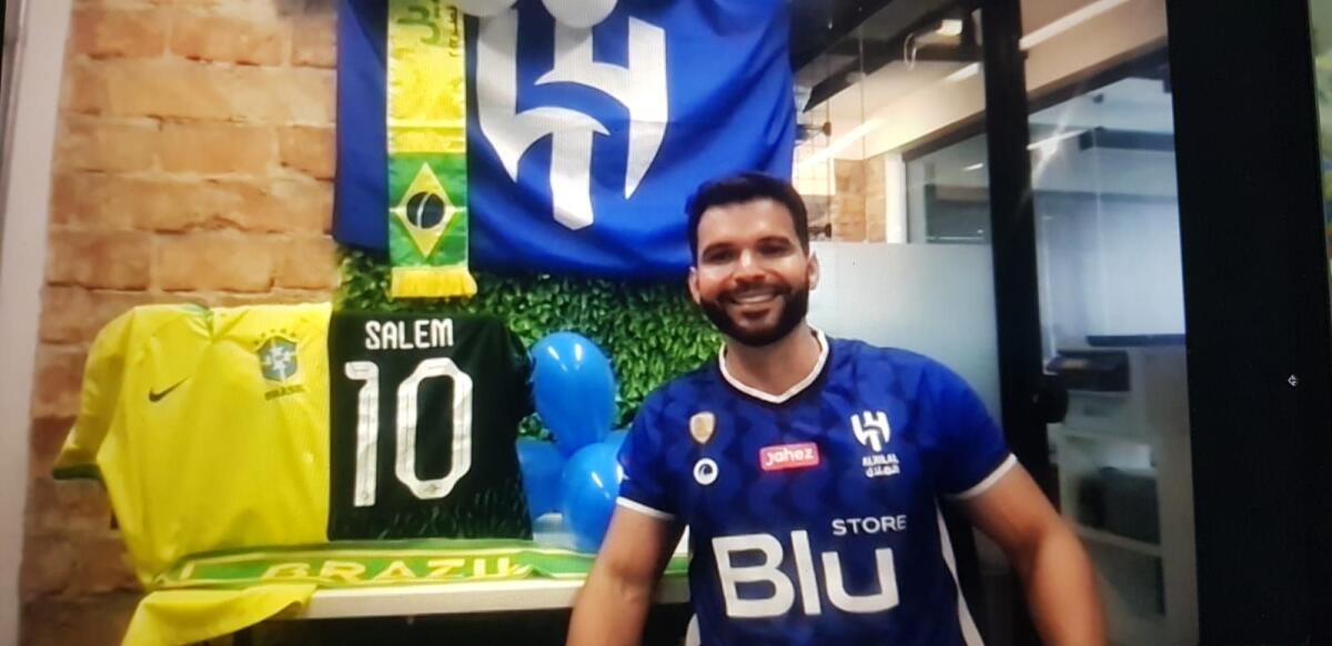 Samuel is seen in the colours of Saudi club Al Hilal at his office in Brazil.