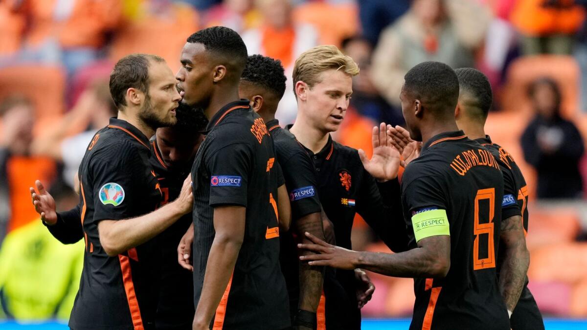Netherlands' Georginio Wijnaldum celebrates scoring the team's third goal with teammates. (Reuters)