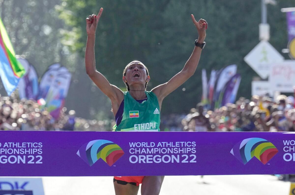 Gotytom Gebreslase of Ethiopia wins the women's marathon at the World Athletics Championships in Eugene on Monday. (AP)