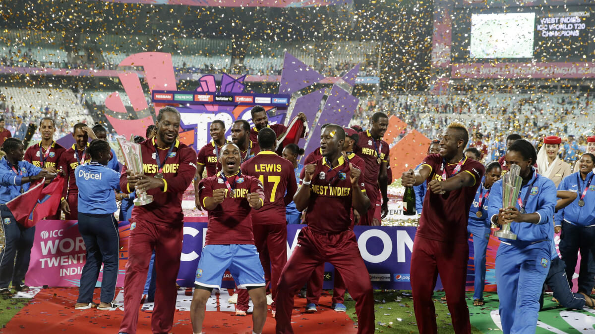 The West Indies men's and women's team celebrate after winning their finals matches of the ICC World Twenty20 2016 cricket tournament at Eden Gardens in Kolkata, India on April 3, 2016