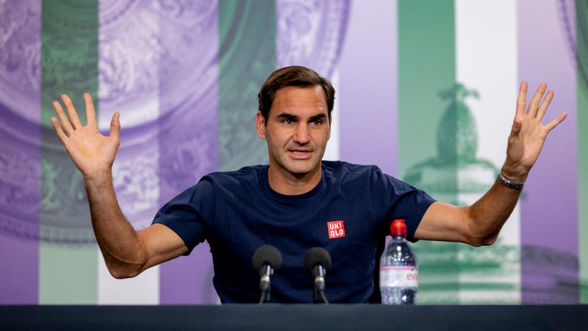 Roger Federer attends a press conference on Saturday. (AP)