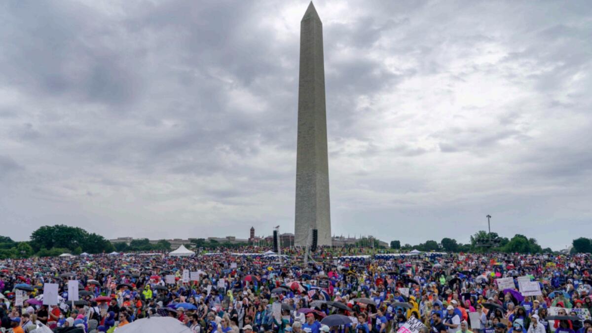 People participate in the second March for Our Lives rally in support of gun control in front of the Washington Monument. — AP