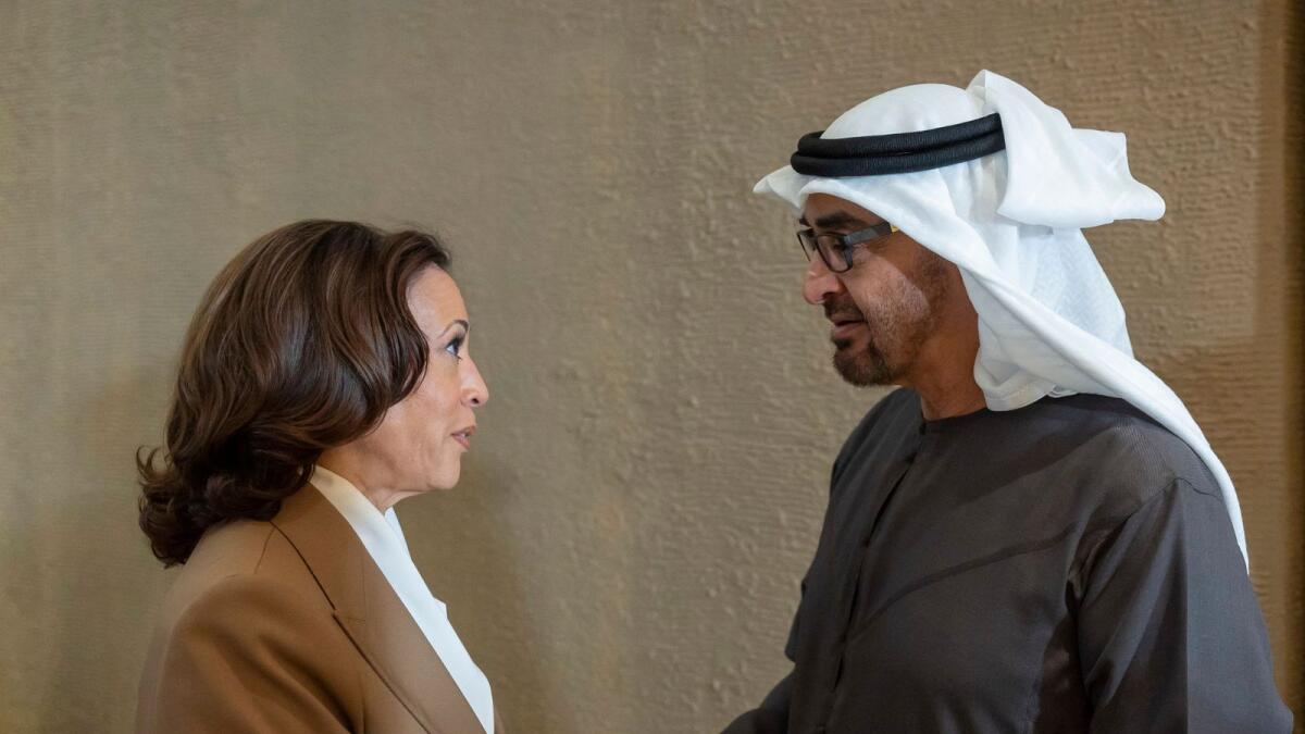 Sheikh Mohamed bin Zayed Al Nahyan greets Kamala Harris before a meeting at COP28 UAE in EXPO City, Dubai. - Reuters