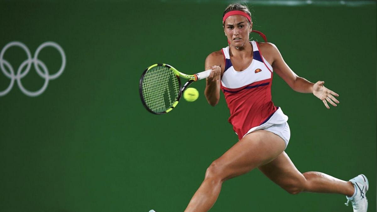 Monica Puig of Puerto Rico in action against Angelique Kerber of Germany. - Reuters file