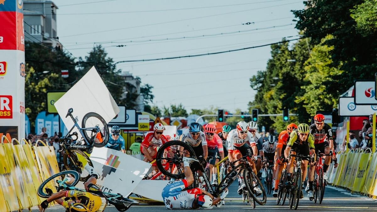Dutch cyclist Fabio Jakobsen's bicycle (behind, left) flies through the air as he collides with compatriot Dylan Groenewegen (on the ground ,left)