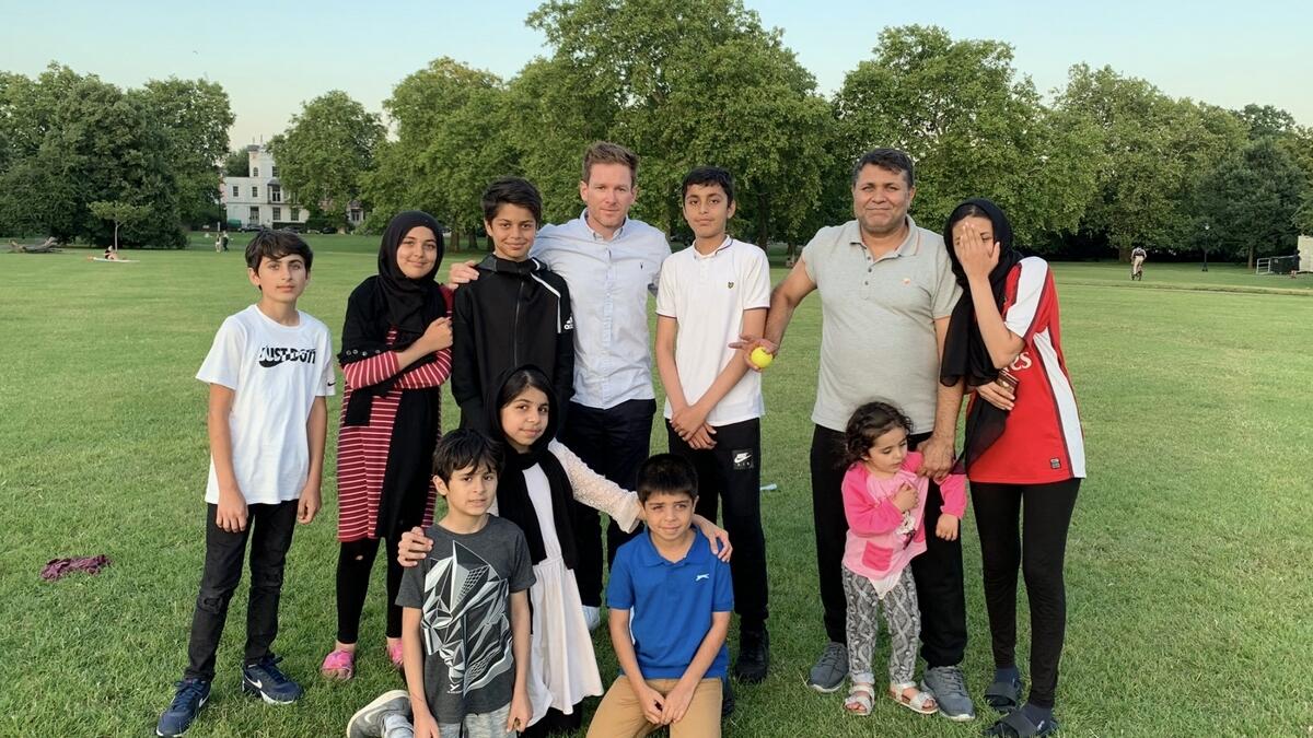 England captain Morgan plays cricket with Afghan family