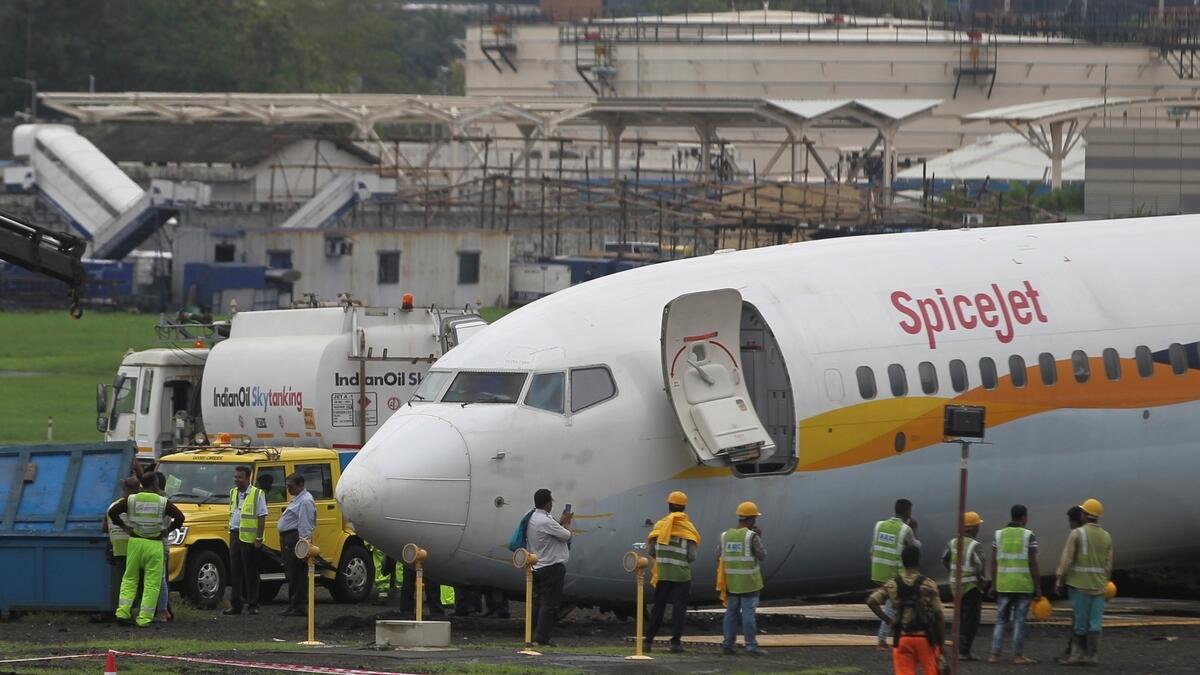 A SpiceJet Boeing 737-800 airplane is seen after it overshot the runway while landing due to heavy rains at an airport in Mumbai, India.-Reuters
