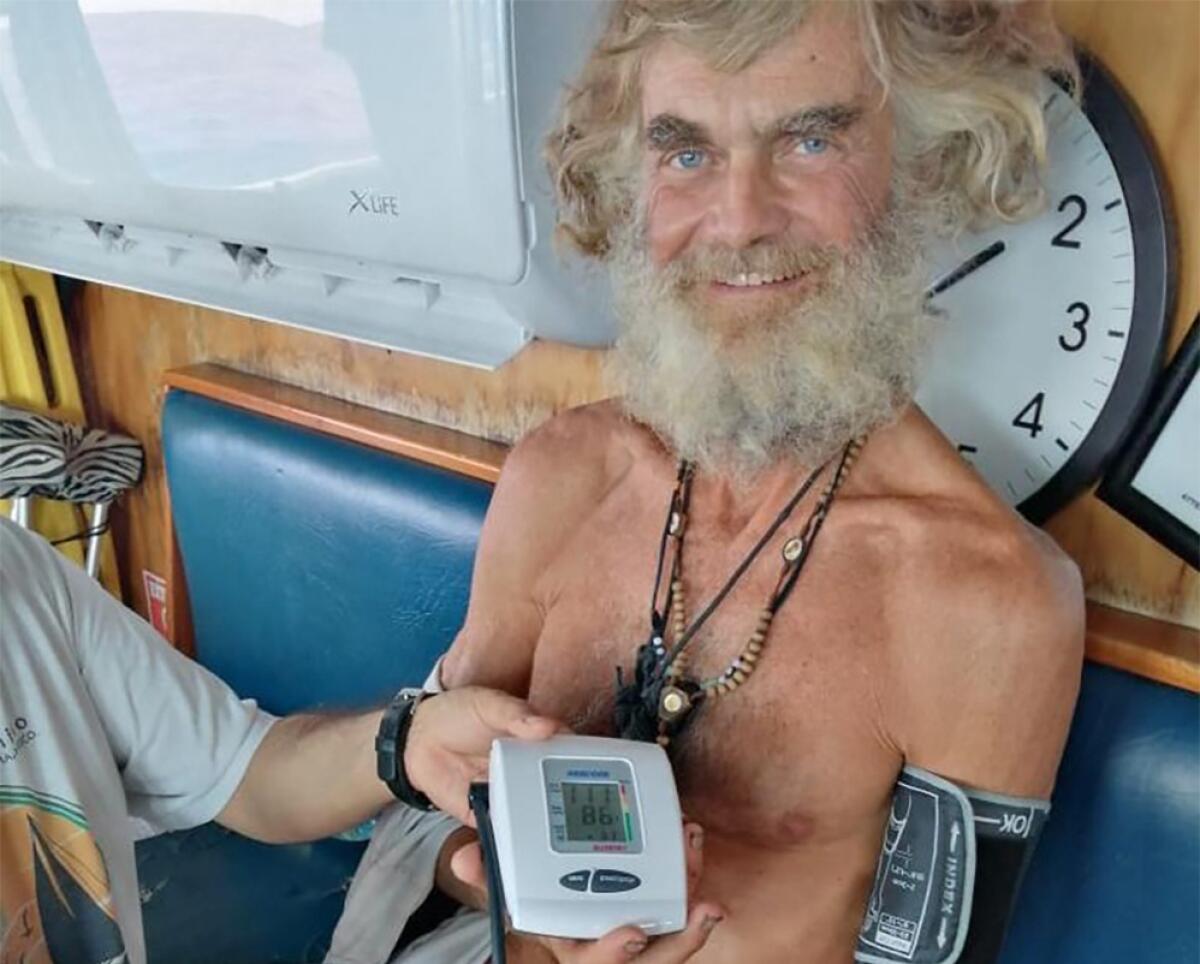 Australian Tim Shaddock has is blood pressure taken after being rescued by a Mexican tuna boat in international waters. (Grupomar/Atun Tuny via AP)