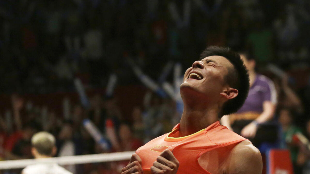 Chen Long celebrates victory over Lee Chong Wei during their men’s singles final in Jakarta.  